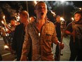 Multiple white nationalist groups march with torches through the University of Virginia campus in Charlottesville, Va., on Friday, Aug. 11, 2017.