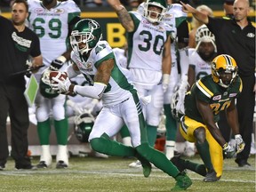 Saskatchewan Roughriders Kacy Rodgers II (45) intercepts the ball on Edmonton Eskimos Bryant Mitchell (80) and runs it in for a touchdown during CFL action at Commonwealth Stadium in Edmonton, August 25, 2017. Ed Kaiser/Postmedia (Edmonton Journal story by Terry Jones)
Ed Kaiser