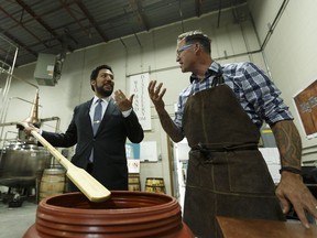 Culture and Tourism Minister Ricardo Miranda, left, is given a tour by Geoff Stewart, owner and head distiller at Rig Hand Craft Distillery, after a press conference announcing Alberta Open Farm Days events and activities, which run Aug. 19 - 20, 2017, at the distillery in Nisku on  Wednesday, Aug. 2, 2017.