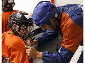 Edmonton Oilers forward Ryan Strome signs the jerseys of young players enrolled in the Oilers Hockey School at Servus Credit Union Place in St. Albert on Friday, August 4, 2017.