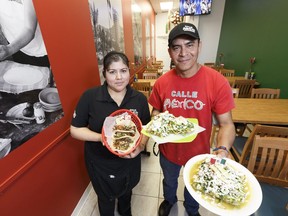 Owners Angelica Del Carmen and Juan Talango pose for a photo in their restaurant Calle Mexico at 11127 107th Ave in Edmonton on Tuesday, August 8, 2017.