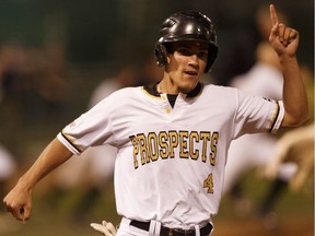 Edmonton Prospects' Derek Shedden (4) celebrates with his team as he scores a winning run over the Medicine Hat Mavericks during a Western Major Baseball League playoff game at RE/MAX Field in Edmonton on Aug. 9, 2017.