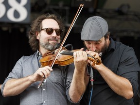 Olivier Demers (left) and Pierre-Luc Dupuis with Solo, a collaboration between bands Le Vent du Nord and De Temps Antan, perform on the main stage during the Edmonton Folk Music Festival at Gallagher Park in Edmonton on Thursday, August 10, 2017.