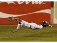 Edmonton Prospects' Derek Shedden (4) catches a hit by Swift Current 57's Blake Adams (24) to win a Western Major Baseball League playoff game at RE/MAX Field in Edmonton, Alberta on Tuesday, August 15, 2017.