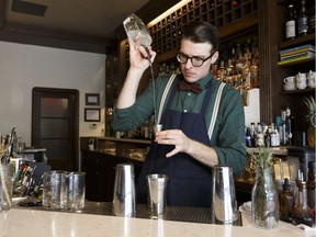 Bar Clementine co-owner Evan Watson makes a Carousel cocktail with gin on Aug. 17, 2017.