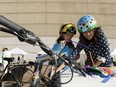 Clara (left) and Lauren Ybema decorate their bikes in the Downtown Edmonton Community League's Family Fun Zone during the Cycle in the City Bike Party in Edmonton, Alberta on Saturday, August 26, 2017.