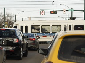 Traffic waits as a Metro Line LRT train crosses 107 Avenue at 105 Street in Edmonton on Wednesday, March 29, 2017. Edmonton released predictions for the Valley Line traffic impacts Thursday.