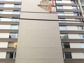 A two storey chunk of the wall came off the Oliver Fairmont condominium at 11920 100 Avenue during a storm on Thursday, Aug. 24 around 5:45 p.m. No one was injured. Catherine Griwkowsky/Edmonton Sun/Edmonton Journal