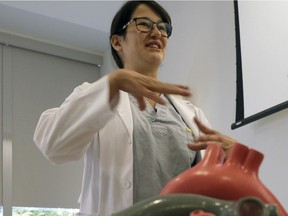 Michiko Maruyama, a cardiac surgery resident and industrial science student at the University of Alberta, is developing toys that help teach kids about medical procedures. She was testing out another one of her medical education resources, a 3D paper anatomical heart model at a summer camp held at the Edmonton Clinic Health Academy on Friday August 18, 2017.