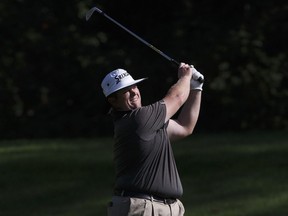 Patrick Newcomb makes his shot from the 17th fairway during the Oil Country Golf Tournament at the Windermere Golf & Country Club on August 6, 2017.