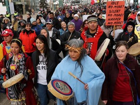 Following the closing ceremonies of the seventh and final Truth and Reconciliation Commission (TRC) event, participants march from the Shaw Conference Centre down Jasper Avenue to the Alberta Legislature, in Edmonton Alta., on Sunday March 29, 2014.