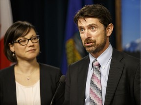 Shannon Phillips (left), Minister of Environment and Parks, and Ed Whittingham, Pembina Institute executive director, speak about an update to Alberta's carbon emissions regulations and the creation of an advisory panel to study the province's climate change policy at the media room at the Alberta Legislature in Edmonton, Alta., on Thursday June 25, 2015. File photo.