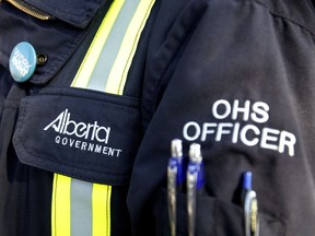 An Alberta Occupational Health and Safety officer stands at a press conference. (File photo)