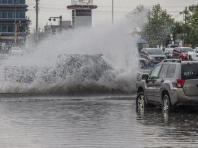 Heavy rain and small hail clogged the parking lot drain in front of Walmart in Capitano Mall on August 5, 2017.