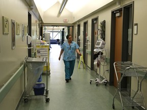 A ward nurse walks through the hall of the Slave Lake Healthcare Centre, one of three clinics in Alberta that operates under the family-care clinic concept advocated by the former Redford government.