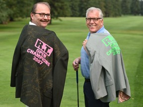 Brian Wilkes (L) and brother Peter Wilkes, their family have been hosting an annual golf tournament for 20 years that is for friends and family in Edmonton, July 19, 2017.