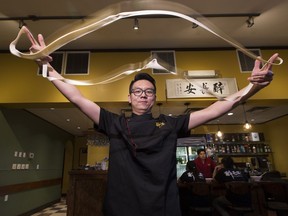 Head chef and assistant manager Xing Duan makes hand-pulled noodles at the Tang Bistro featuring Shanxi-style Chinese food on Aug. 18, 2017, in Edmonton.