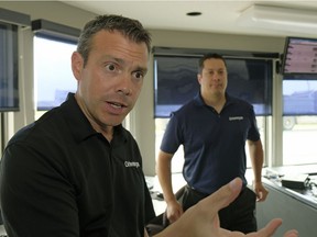 Drivewyze president Brian Heath, left, and vice-president, technology Brian Moffard at a commercial vehicle inspection station south of Edmonton on Aug. 24, 2017. Drivewyze is an Edmonton-based startup company that delivers commercial vehicle safety solutions, specifically a GPS and internet-based weigh station bypass service. The company operates in most American states and is just starting to work in Alberta.