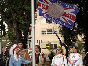 Edmonton Mayor Don Iveson and Wilton Littlechild, the Grand Chief of Treaty 6, raise the Treaty 6 flag at a ceremony outside City Hall on Recognition Day, Aug. 18, 2017.