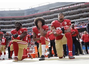 Colin Kaepernick, centre, gained attention for his protests during the playing of the U.S. national anthem, motivated by what he viewed as the oppression of black Americans, killed during interactions with police.