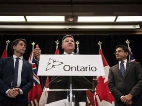 Ontario Minister of Finance, Charles Sousa, centre, Attorney General, Yasir Naqvi, right, and Minister of Health and Long-Term Care, Eric Hoskins speak during a press conference where they detailed Ontario's solution for recreational marijuana sales, in Toronto on Friday, September 8, 2017.