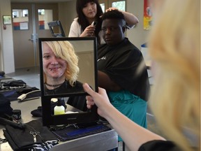 Kiana Havens checks out her new haircut as youths between the ages of 13 and 29 experiencing housing insecurity or homelessness, were offered a variety of services and help from agencies during the 4th Annual YEG Youth Connect at the Boyle Street Plaza in Edmonton, Sept.14, 2017.