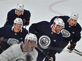 Edmonton Oilers players Connor McDavid (97), Patrick Maroon (19), Zack Kassian (44) and Ryan Strome (18) back on the ice during the first day of training camp at Rogers Placein Edmonton on Sept. 15, 2017.
