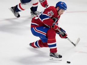 Montreal Canadiens defenceman Victor Mete struggles to control the puck during preseason NHL play against the Washington Capitals at the Bell Centre in Montreal on Wednesday September 20, 2017.