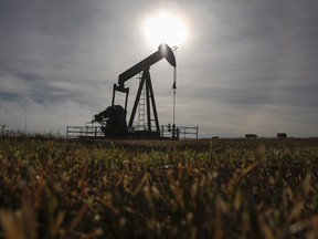 A pumpjack works at a well head on an oil and gas installation near Cremona, Alta., Saturday, Oct. 29, 2016.The Canadian economy exits 2016 with bruises from the still-tough adjustment to weak crude prices and scars from the devastating wildfires that singed the oil patch. THE CANADIAN PRESS/Jeff McIntosh ORG XMIT: CPT117