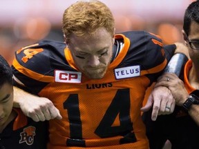 B.C. Lions quarterback Travis Lulay is helped off the field as he leaves the game after being injured during the first half of a CFL football game against the Montreal Alouettes in Vancouver, B.C., on Friday September 8, 2017. Lulay will miss the rest of the CFL season due to a right knee injury. THE CANADIAN PRESS/Darryl Dyck