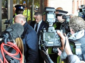 Wayne Rooney, centre arrives at Stockport Magistrates Court in Stockport, England, Monday, Sept. 18, 2017. The 31-year-old Everton striker is appearing in court on alleged drink driving charges. (AP Photo/Rui Vieira)