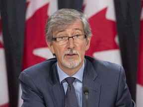 Privacy commissioner Daniel Therrien is seen during a press conference in Ottawa, Tuesday, September 27, 2016. The federal privacy czar says Canadians should be very concerned about their cellphones, computers and other electronic devices being searched by U.S. border agents. THE CANADIAN PRESS/Adrian Wyld