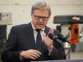 Education Minister David Eggen announces the results of a curriculum survey in a trades classroom at Westmount Junior High School, in Edmonton Thursday April 13, 2017.