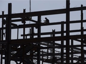 Crews work on the construction of the retirement community Village at Westmount, near Groat Road and 115 Ave., in Edmonton Tuesday Aug. 15, 2017.