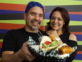 Rolando Sandrea and Samanta Gonzalez pose for a photo at their Venezuelan restaurant Avila Arepa, 10760 Whyte Ave., in Edmonton on Tuesday, Sept. 19, 2017.