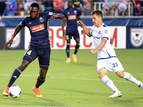 FC Edmonton midfielder Jake Keegan challenges North Carolina FC midfielder James Marcelin in North American Soccer League play at WakeMed Soccer Park in Cary, North Carolina on Saturday, Sept. 2, 2017.