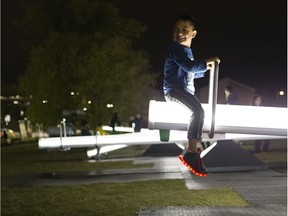 Hunter Brunette, 6, enjoys himself on the luminescent seesaws on Sunday, Sept. 24, 2017., that transforms The Quarters into an interactive art playground.