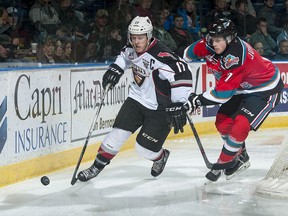 Tyler Benson controls the puck in game action against Kelowna Rockets.