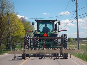 Slow-moving farm equipment is a common sight at this time of year. File photo.