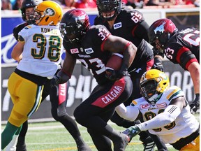 Calgary Stampeders running back Jerome Messam runs the all against the Edmonton Eskimos during the first half of the Labour Day Classic at McMahon Stadium, Monday September 4, 2017.
