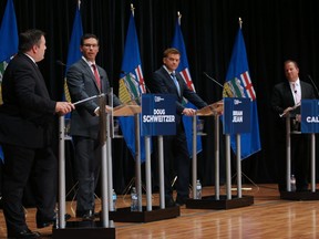 United Conservative Party leadership candidates Jason Kenney, left, Doug Schweitzer, Brian Jean and Jeff Callaway take part in a leadership debate in Calgary on Sept. 20, 2017.