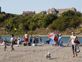 People enjoy a hot summer day on "Accidental Beach" in Edmonton on Tuesday, August 29, 2017.