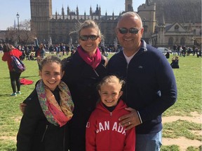 Cristy Cunningham, left, and her husband Robert Gomez pose for a photo with their two children. A former Edmontonian, Cunningham has lived in Miami for 13 years and is preparing to ride out hurricane Irma.