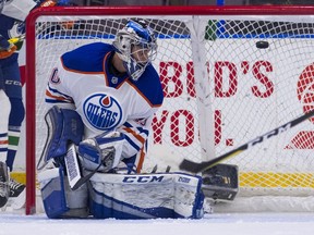 Edmonton Oilers goalie Shane Starrett watches the puck sail wide of the net during NHL rookie tournament action against the Vancouver Canucks at the Young Stars Classic held at the South Okanagan Events Centre in Penticton, B.C., Sept. 11, 2017.
