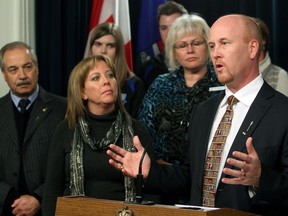 Alberta Education Minister Jeff Johnson (right) discusses the provincial government's proposed new Education Act at the Alberta Legislature, Tuesday October 23, 2012.