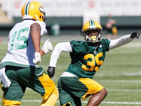 Vidal Hazelton, left, runs against Forrest Hightower during Edmonton Eskimos training camp at Commonwealth Stadium in Edmonton on Monday, May 29, 2017.