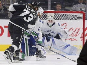 Vancouver Canucks goalie Jacob Markstrom eyes a shot from Los Angeles Kings forward Tyler Toffoli on Sept. 16.