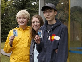 Lita Bablitz (centre) is seen with sons Pearson (left), 12, and Jasper, 15, at the bus stop they use to attend school at Avalon Junior High School and Harry Ainlay High School, respectively, in Edmonton on Thursday, Sept. 21, 2017.