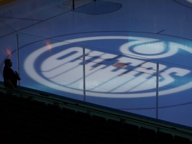 A fan looks over the ice before a pre-season NHL game between the Edmonton Oilers and the Carolina Hurricanes on Sept. 25, 2017, at Rogers Place in Edmonton.