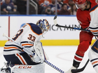 Edmonton Oilers goaltender Cam Talbot makes a save against the Carolina Hurricanes during NHL pre-season action on Sept. 25, 2017, at Rogers Place in Edmonton.